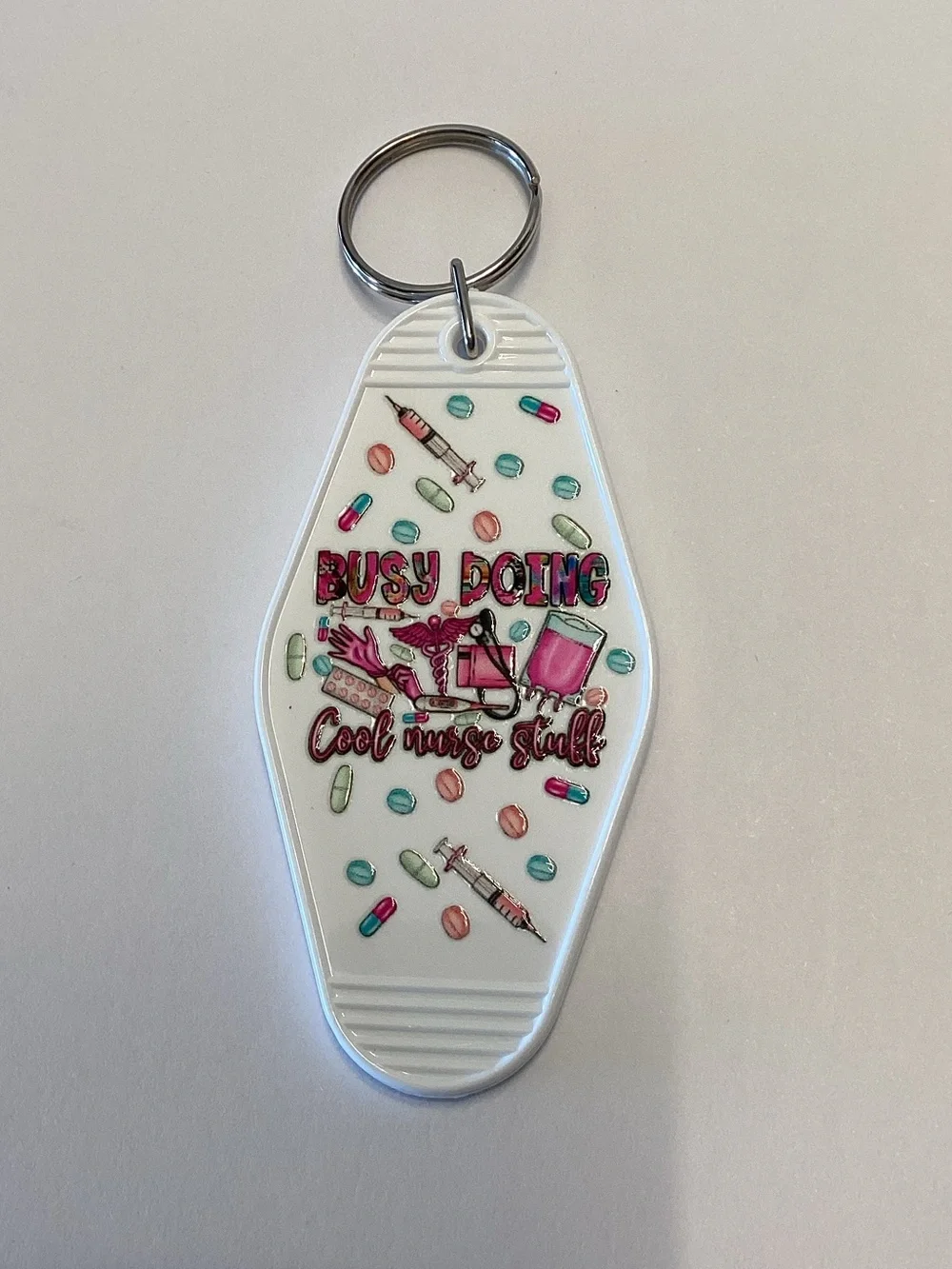 White Nurse-Themed Keychain Charm with Pink & Teal Accents